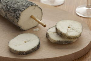 Fresh Sainte-Maure de Touraine and a slice close up